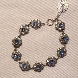 Bracelet, 10 flowers with blue stones/relig medal